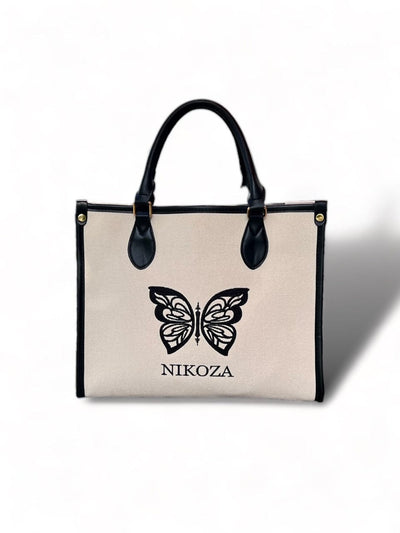 beige-black Beach Bag 2023 Beige/Black Beige Canvas Tote Beach Bag with black leather handles and Black leather trim Olga Nikoza Swimwear