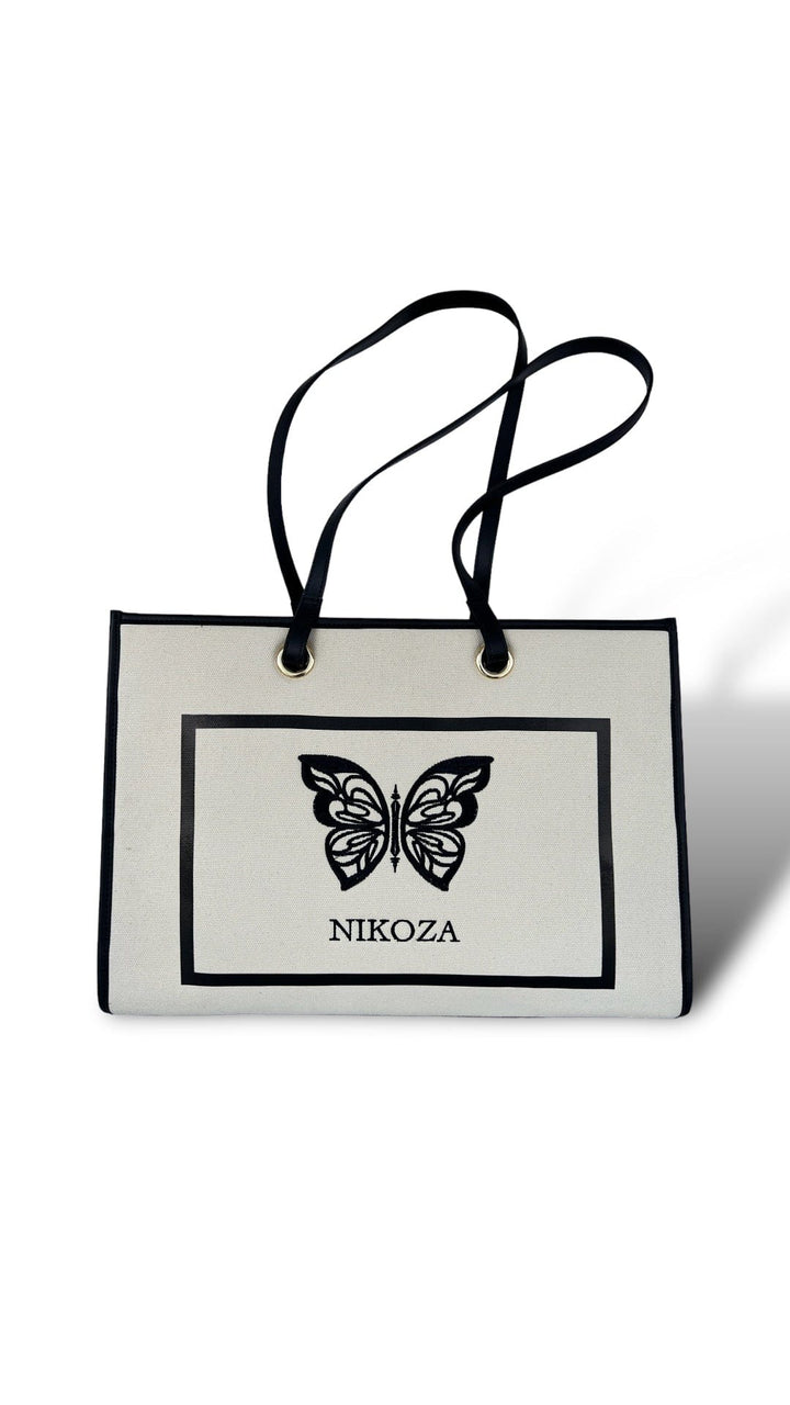 black-beige Tina Beach Tote Bag 2023 Beige/Black Beige Canvas Tote Beach Bag with black leather handles and Black leather trim Olga Nikoza Swimwear
